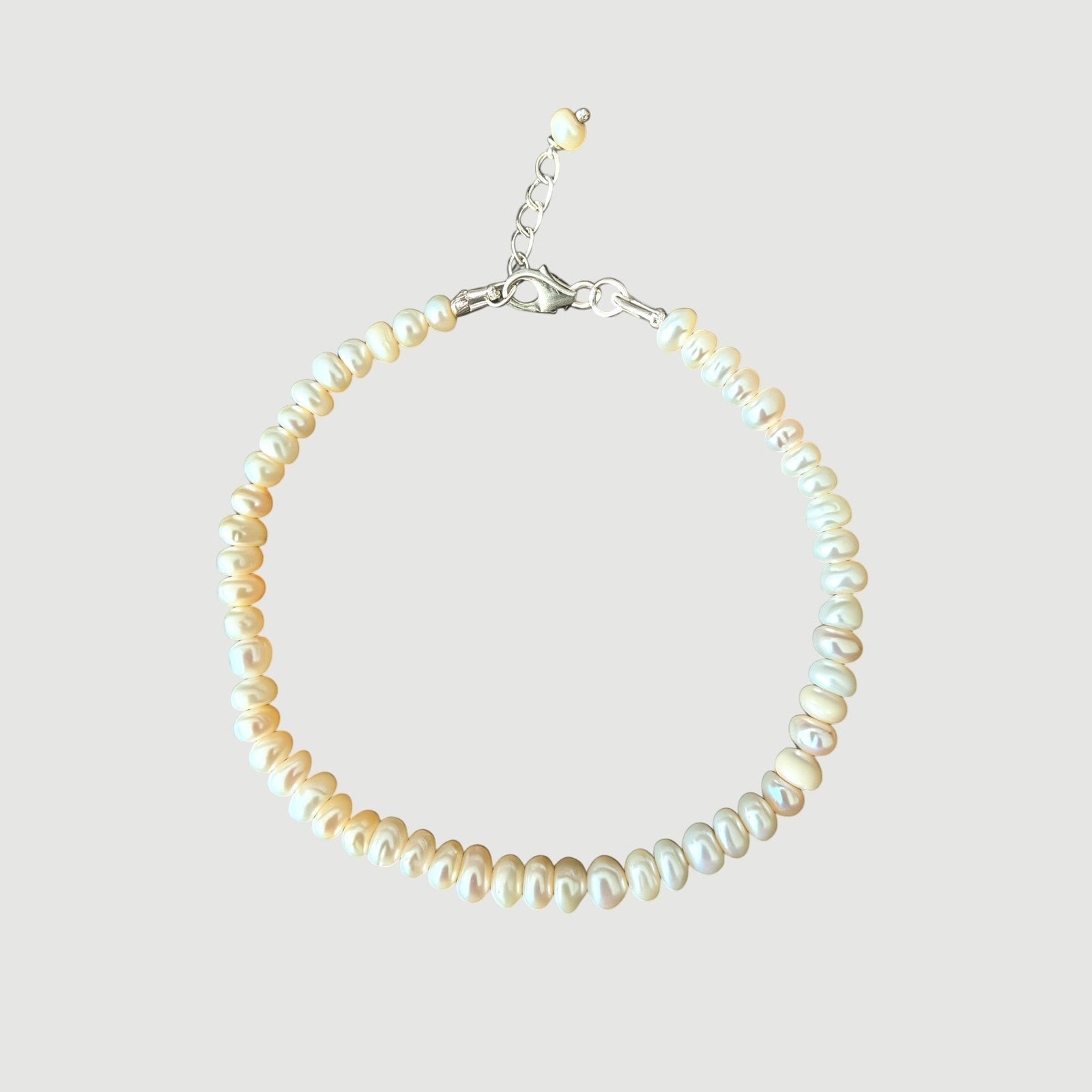 Amara Jewels Freshwater Pearl Bracelet with adjustable silver clasp and extender chain. Features lustrous, organically shaped pearls.