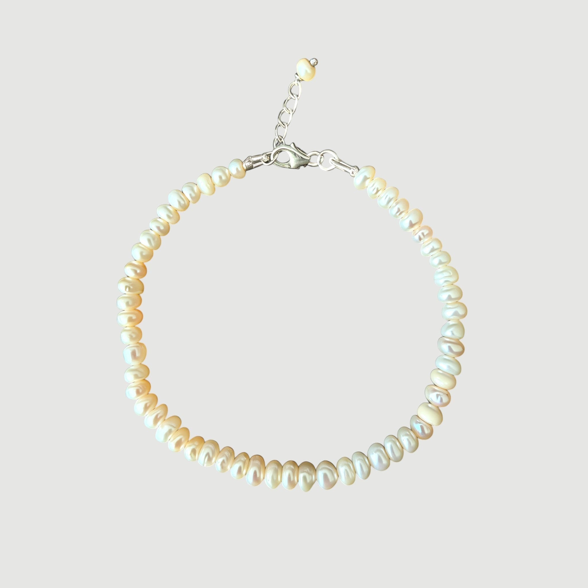 Amara Jewels Freshwater Pearl Bracelet with adjustable silver clasp and extender chain. Features lustrous, organically shaped pearls.