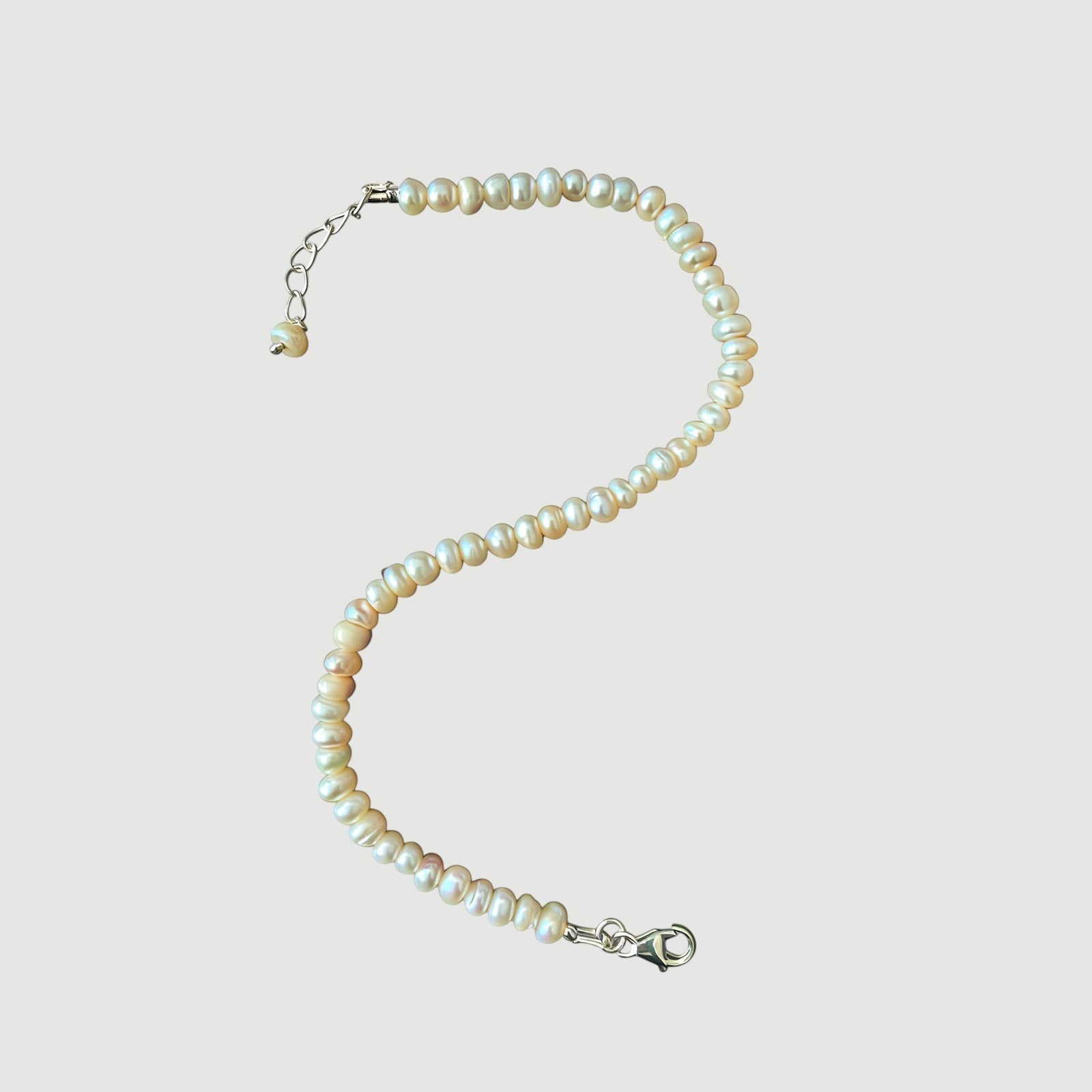 Amara Jewels Freshwater Pearl Bracelet with sterling silver clasp and extender chain. White pearls with natural luster.