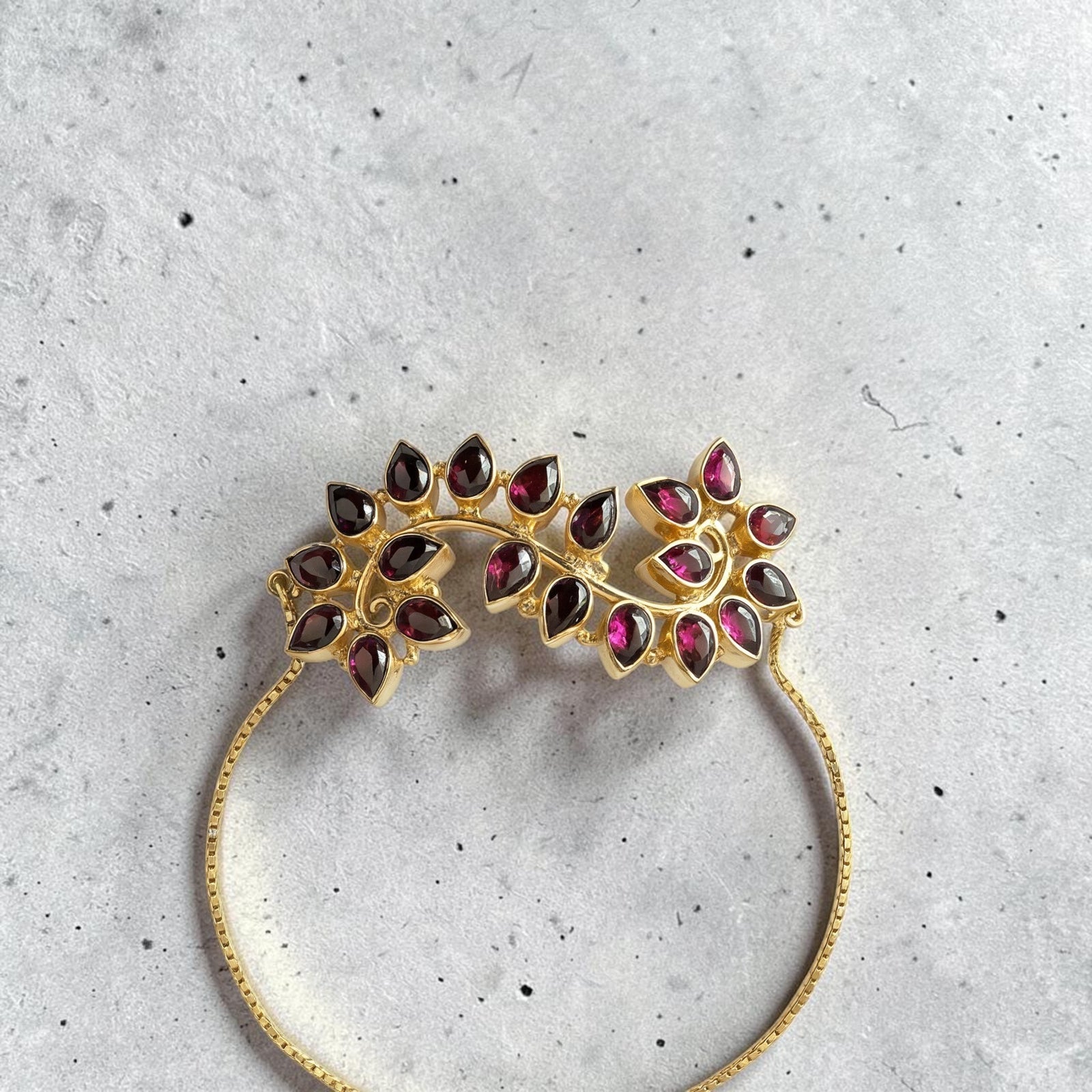 Amara Jewels Radiant Bloom Garnet Bracelet with pear-cut garnet stones in a floral vine design, 925 sterling silver with gold vermeil finish.
