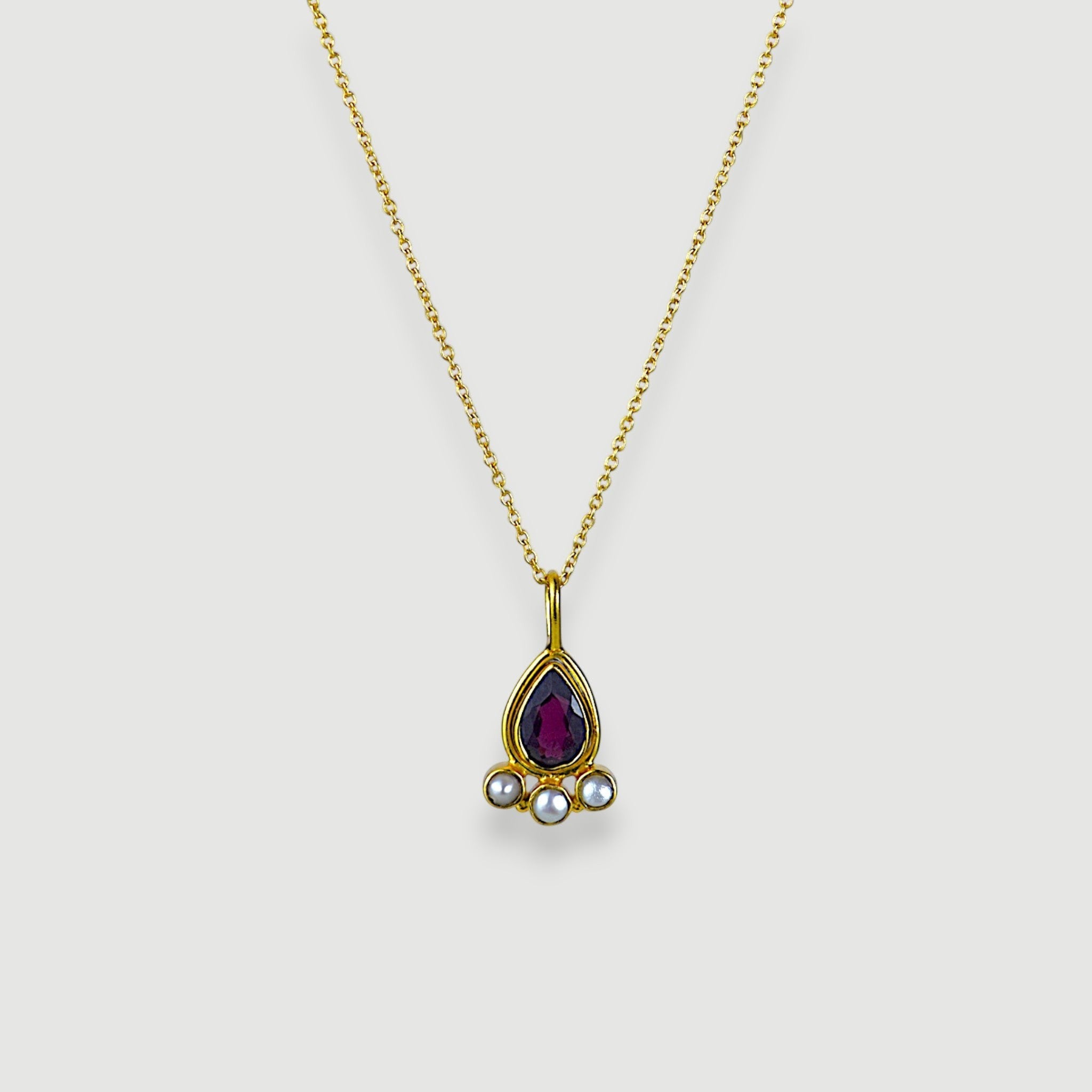 Amara Jewels teardrop necklace with deep red garnet and three pearls, set in 18K gold vermeil over sterling silver.