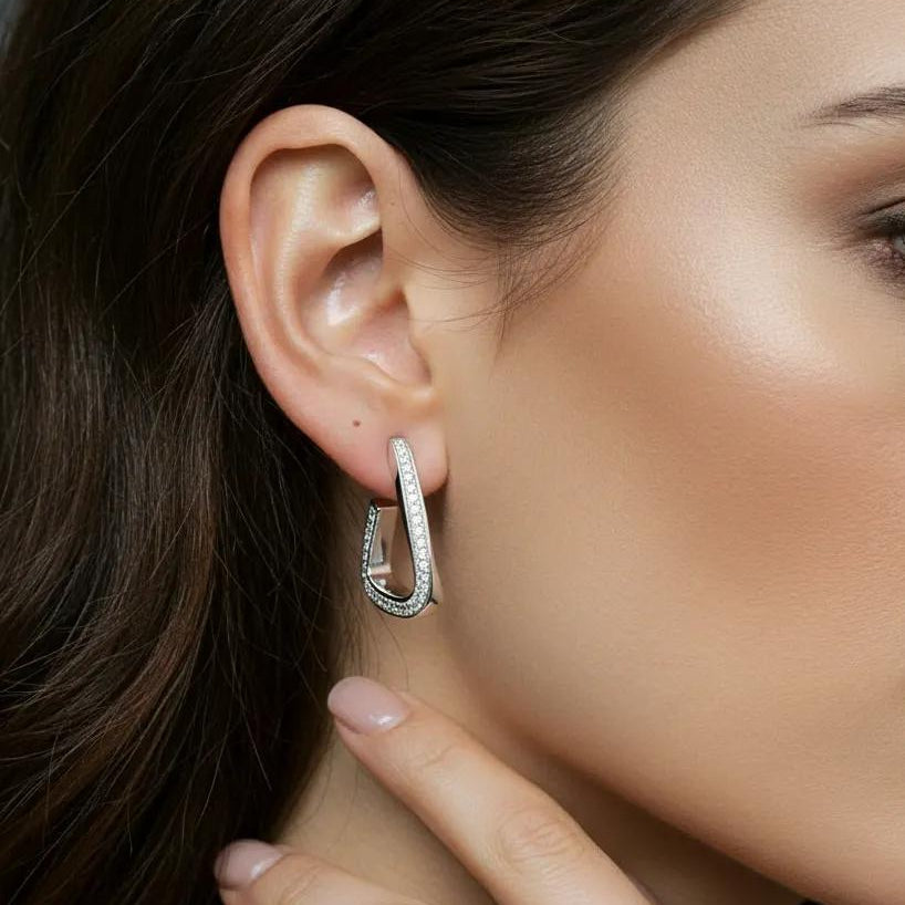Amara Jewels Sterling Silver Geometric Crystal Hoop Earrings with sparkling crystals on the front edge.