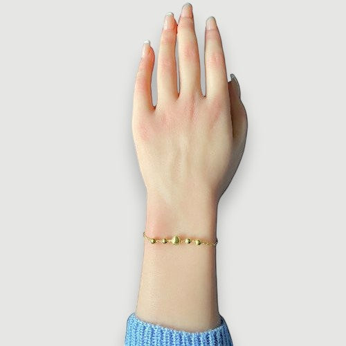 Amara Jewels gold-plated sterling silver bracelet with delicate chain and polished, textured beads.