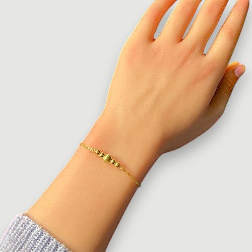 Amara Jewels gold-plated sterling silver bracelet with delicate chain and polished, textured beads.