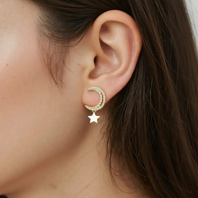 Amara Jewels gold-plated sterling silver crescent moon earrings with cubic zirconia and dangling star charm.