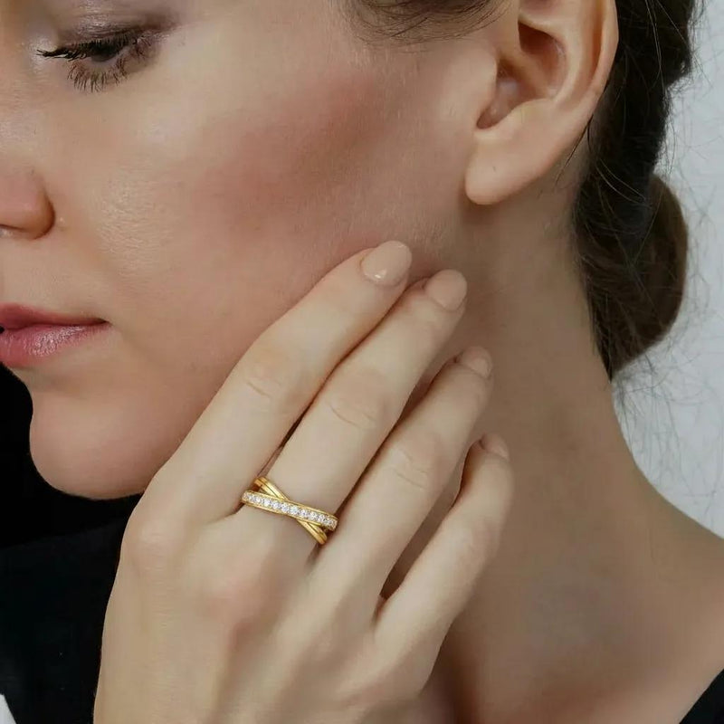 Amara Jewels gold-tone 925 sterling silver criss-cross ring with pavé cubic zirconia stones.