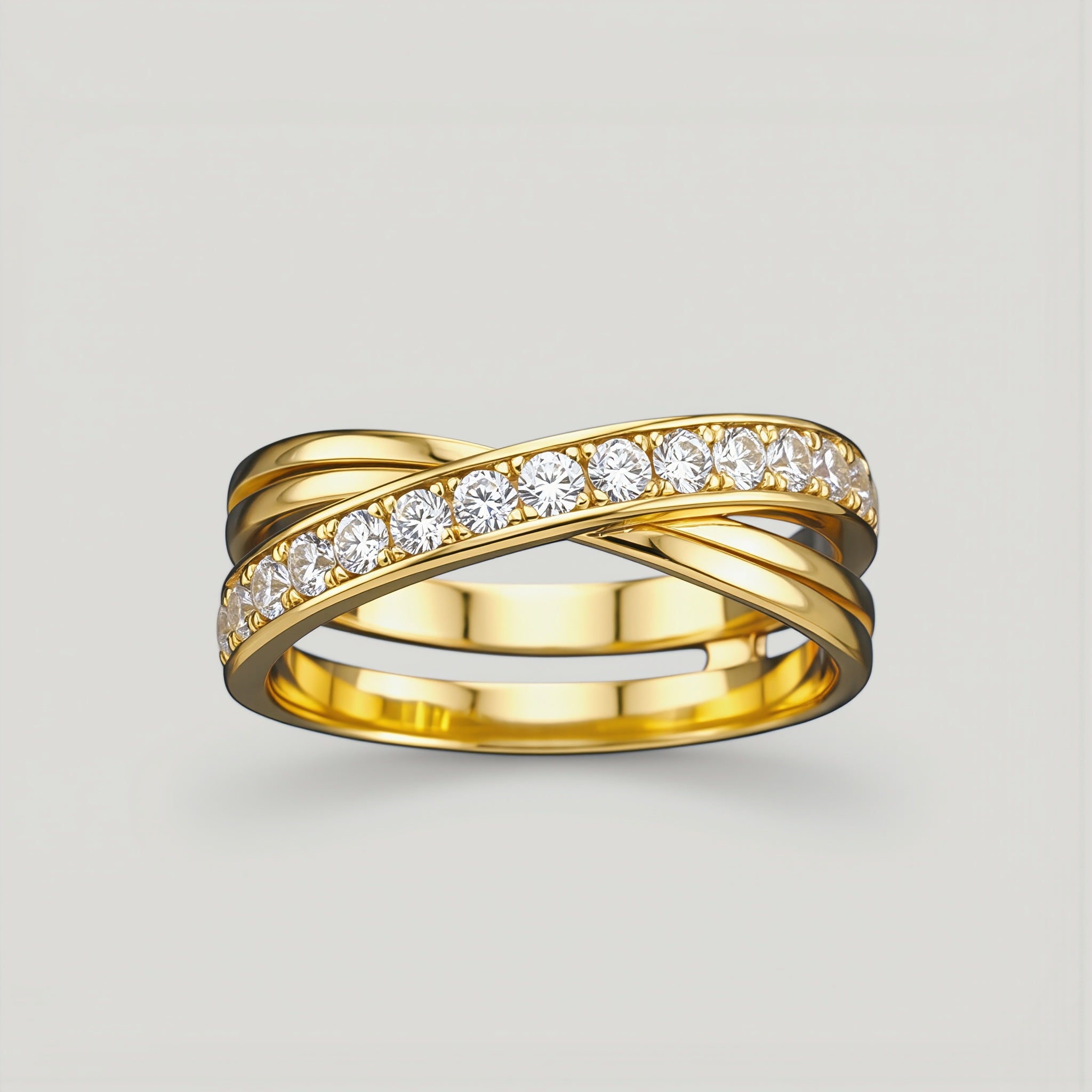 Amara Jewels gold-tone 925 sterling silver criss-cross ring with pavé cubic zirconia stones.