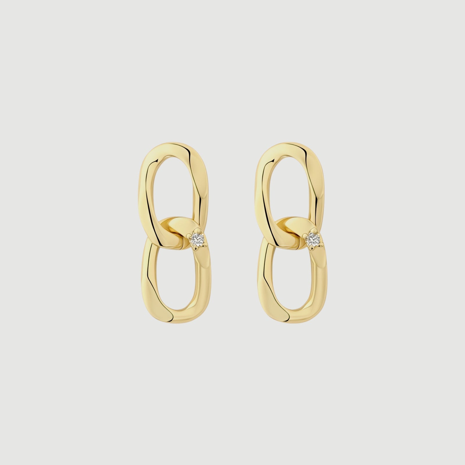 Amara Jewels gold-plated sterling silver double link drop earrings with cubic zirconia accent.