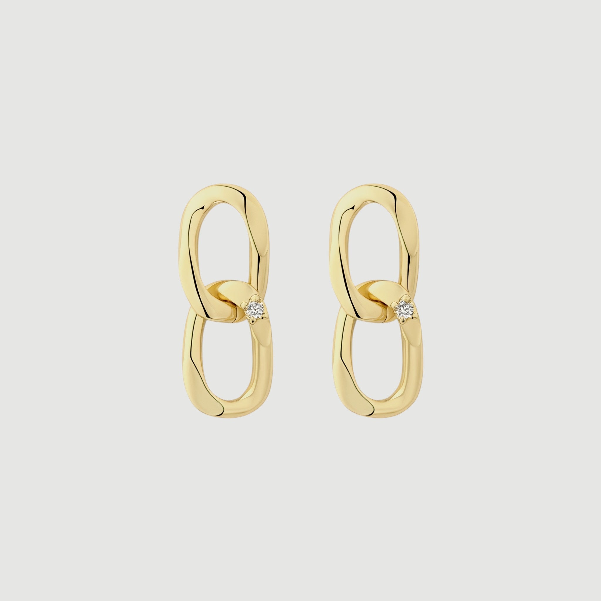 Amara Jewels gold-plated sterling silver double link drop earrings with cubic zirconia accent.