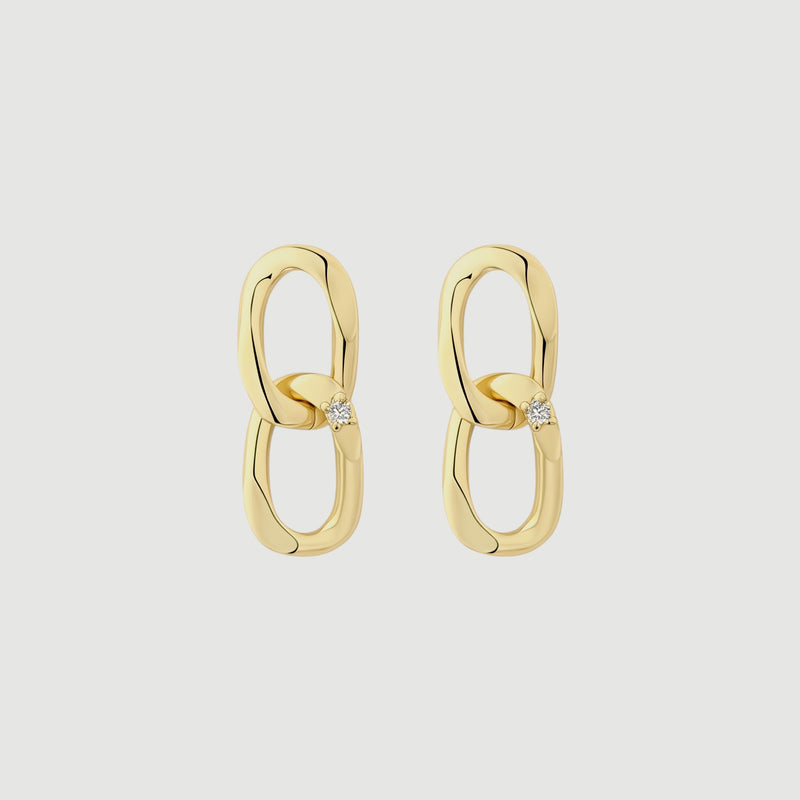 Amara Jewels gold-plated sterling silver double link drop earrings with cubic zirconia accent.