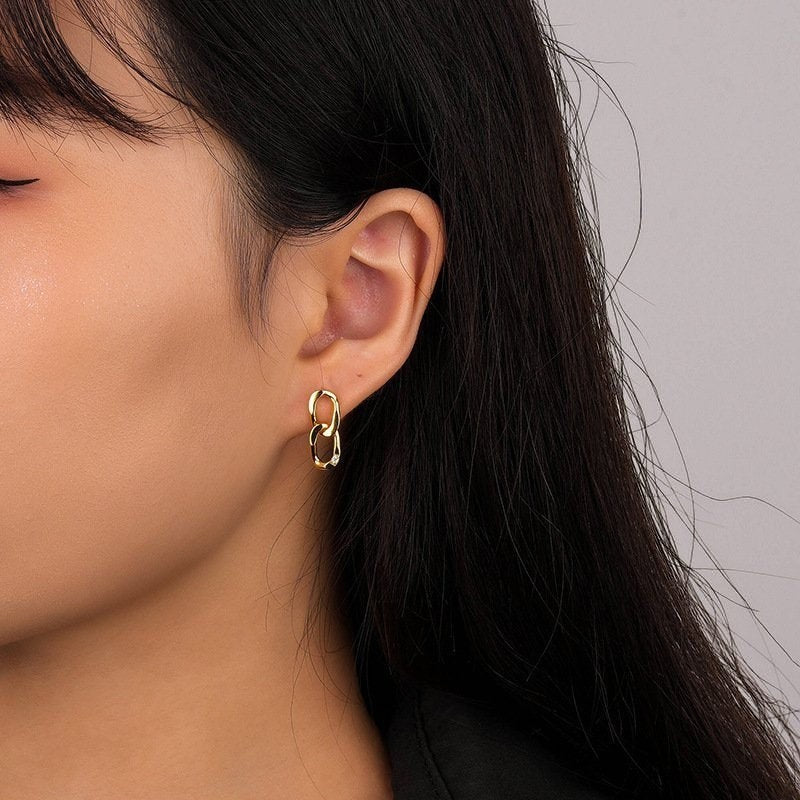 Amara Jewels gold-plated sterling silver double link drop earrings with cubic zirconia accent.