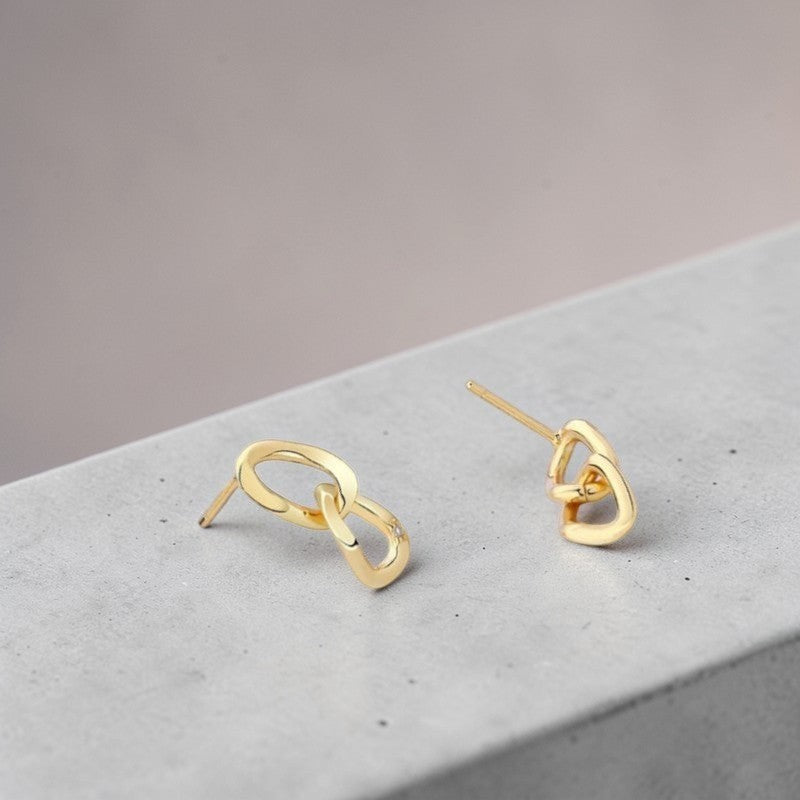 Amara Jewels gold-plated sterling silver double link drop earrings with cubic zirconia accent.