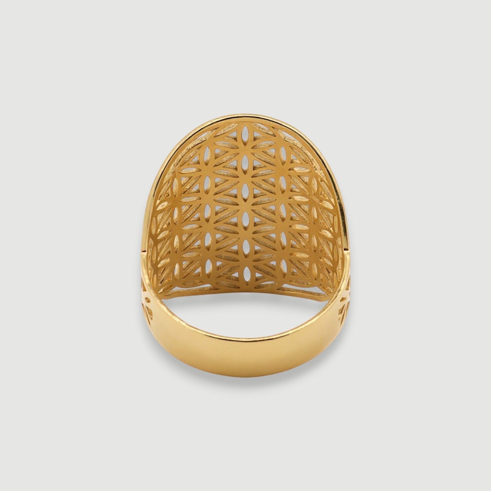 Amara Jewels gold vermeil statement ring with floral cutout pattern and sacred geometry design.