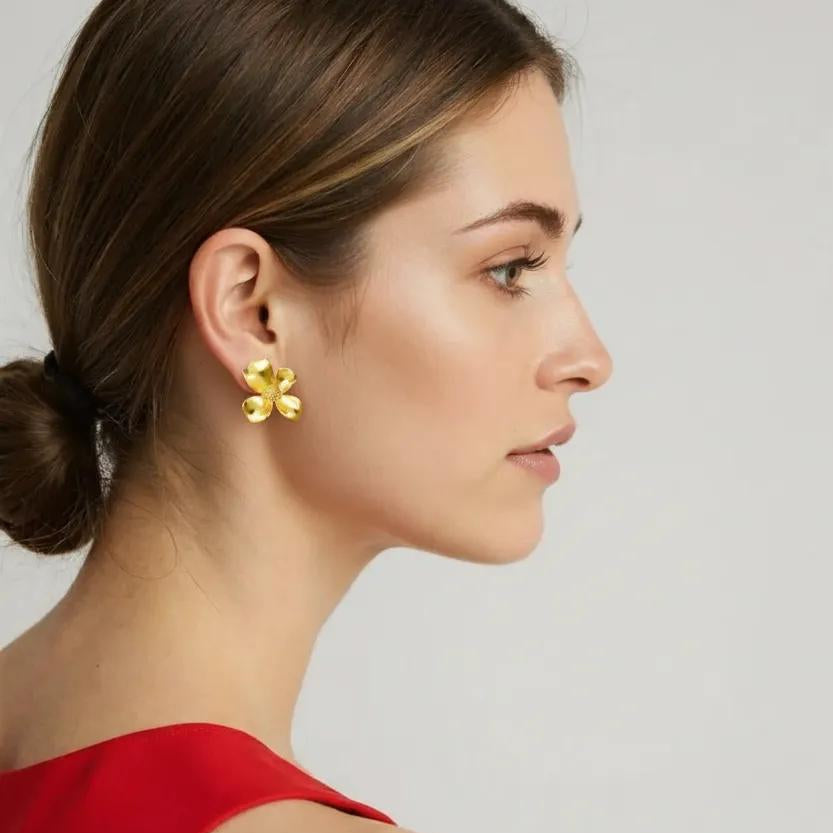 Amara Jewels gold-vermeil sterling silver floral stud earrings with textured petals.