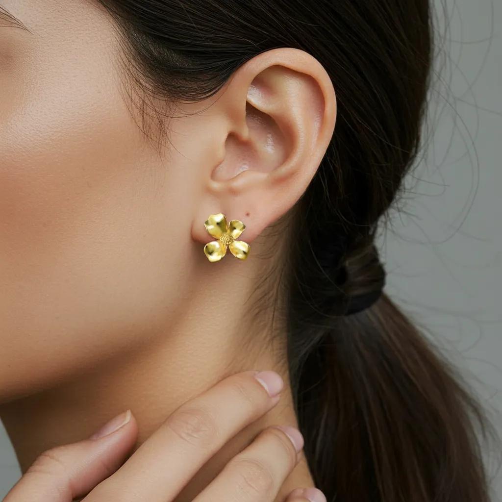 Amara Jewels gold-vermeil sterling silver floral stud earrings with textured petals.
