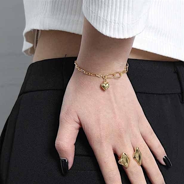 Amara Jewels 18K yellow gold-plated adjustable sterling silver bracelet with elongated links and a polished heart charm.