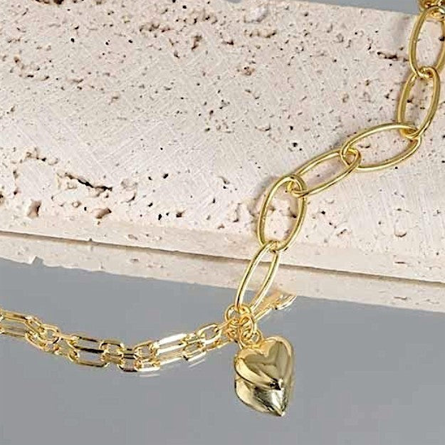 Amara Jewels 18K yellow gold-plated adjustable sterling silver bracelet with elongated links and a polished heart charm.