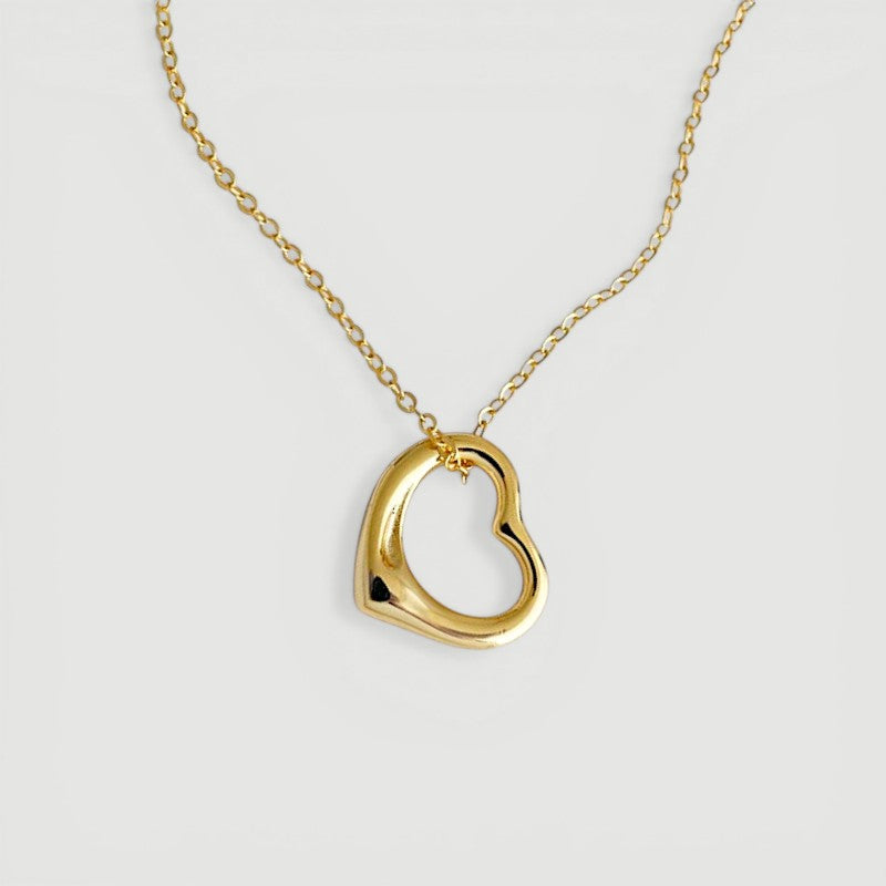 Amara Jewels gold-plated sterling silver hollow heart pendant necklace on a delicate chain.