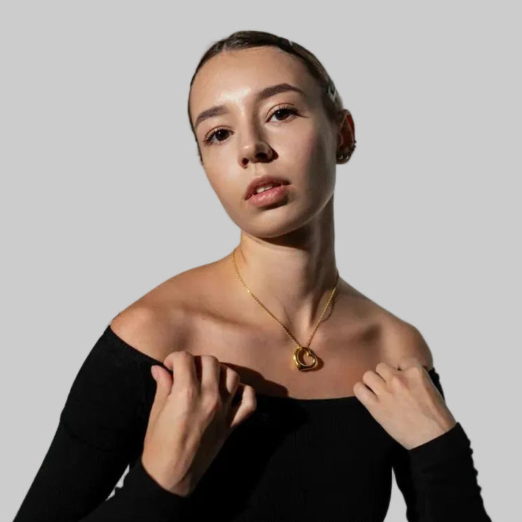 Amara Jewels gold-plated sterling silver hollow heart pendant necklace on a delicate chain.