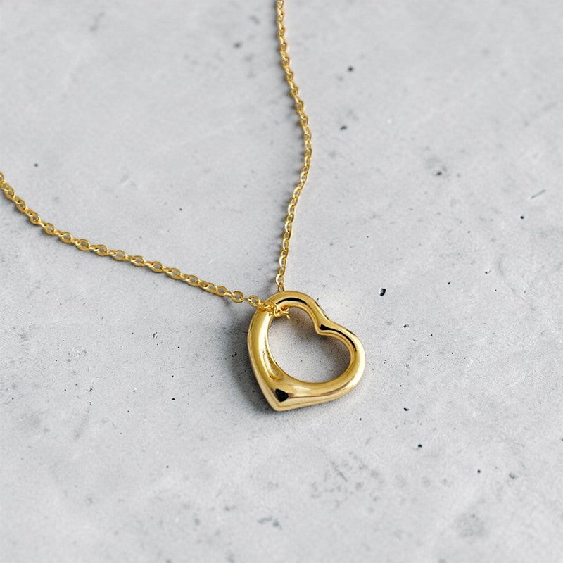Amara Jewels gold-plated sterling silver hollow heart pendant necklace on a delicate chain.