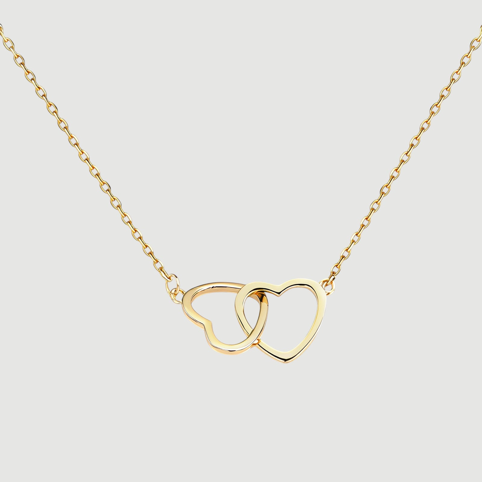 Amara Jewels gold interlocking hearts necklace with hollow design, perfect for gifting.
