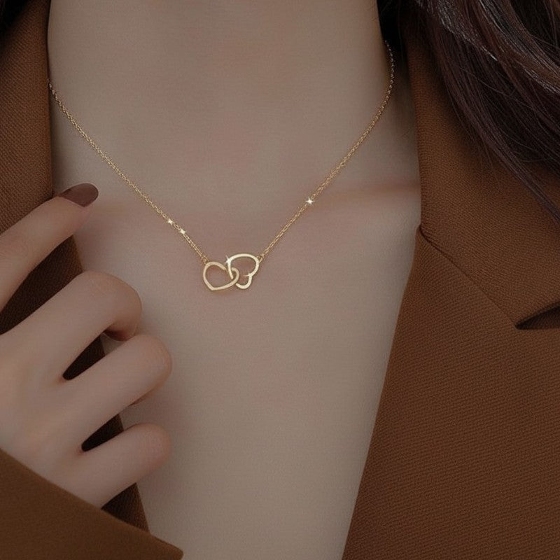 Amara Jewels interlocking hollow hearts necklace in gold, symbolizing connection and affection.