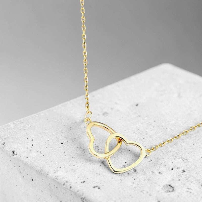 Amara Jewels gold interlocking hearts necklace with hollow design, perfect for gifting.