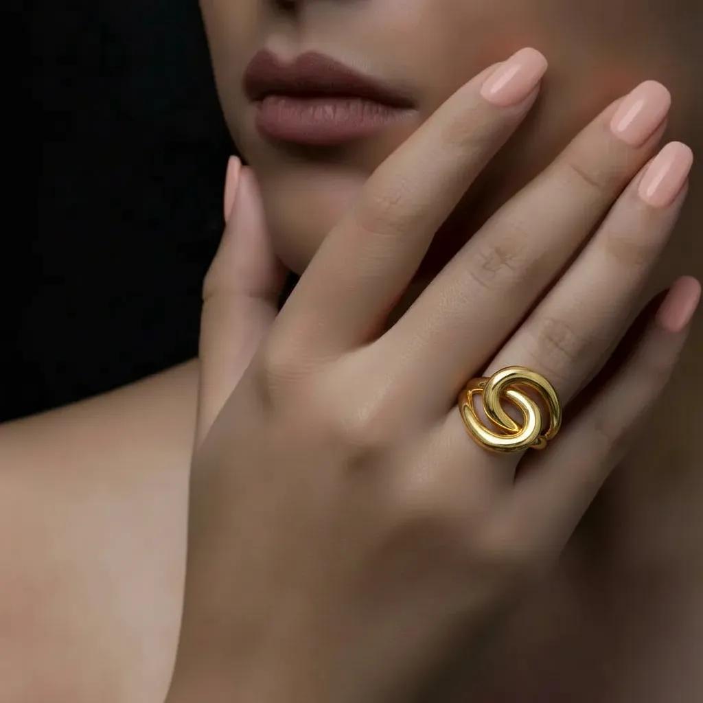 Amara Jewels gold-plated 925 sterling silver adjustable knot ring. Modern, polished gold finish.