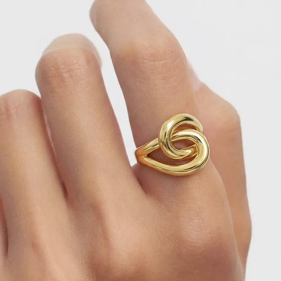 Amara Jewels gold-plated 925 sterling silver adjustable knot ring. Modern, polished gold finish.
