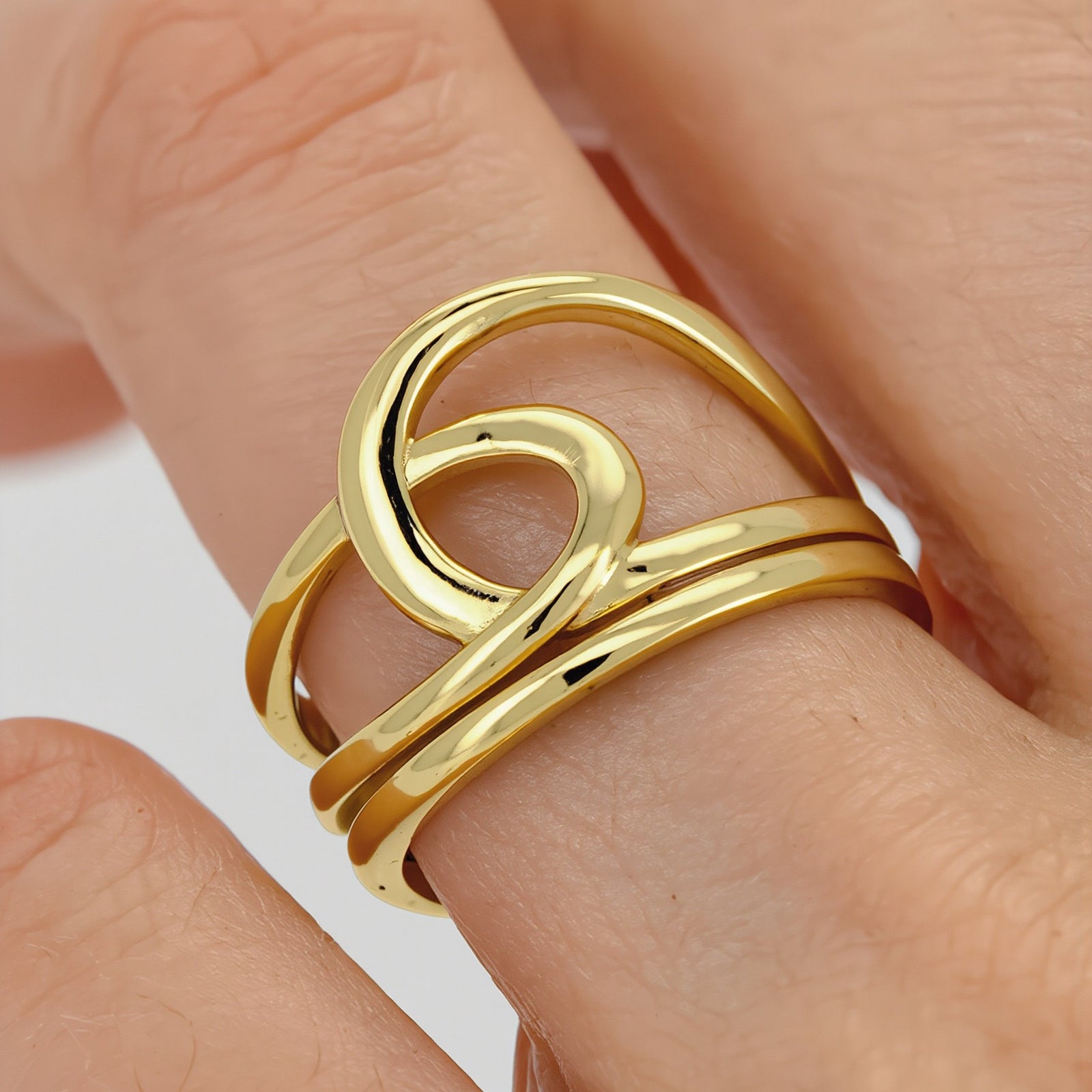 Amara Jewels gold-plated 925 sterling silver ring with an open knot design. Adjustable.
