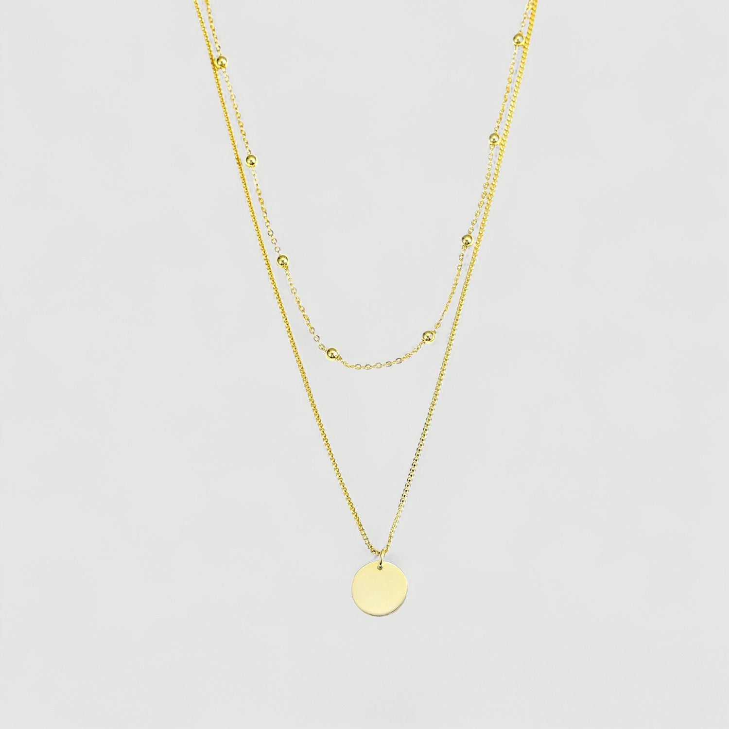 Amara Jewels gold-plated sterling silver layered necklace with bead chain and disc charm.