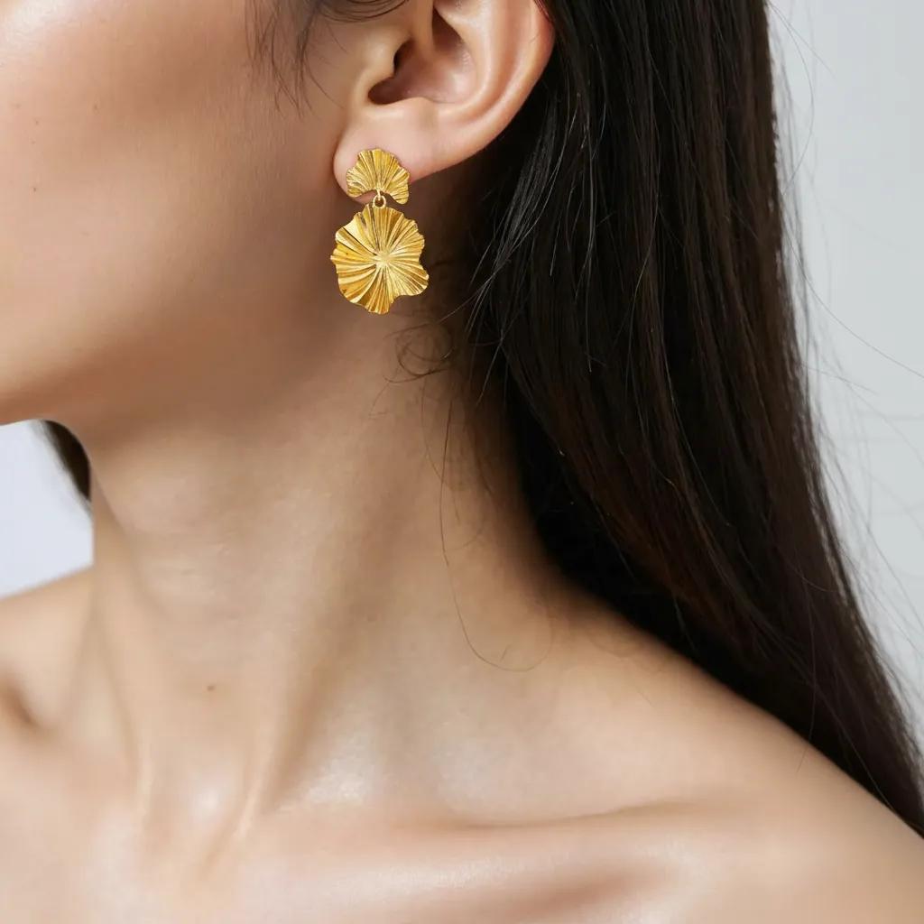 Amara Jewels gold-plated sterling silver leaf drop earrings with layered, textured design.