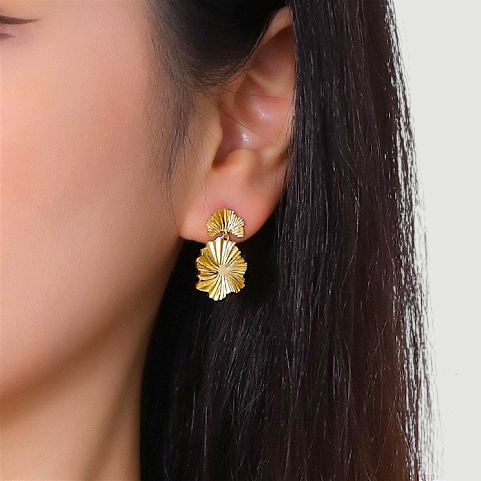 Amara Jewels gold-plated sterling silver leaf drop earrings with layered, textured design.
