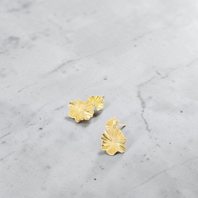 Amara Jewels gold-plated sterling silver leaf drop earrings with layered, textured design.
