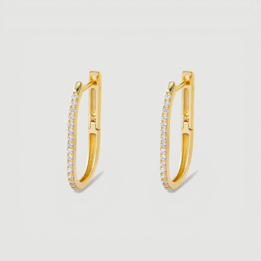 Amara Jewels gold-plated sterling silver oval hoop earrings with cubic zirconia accents.