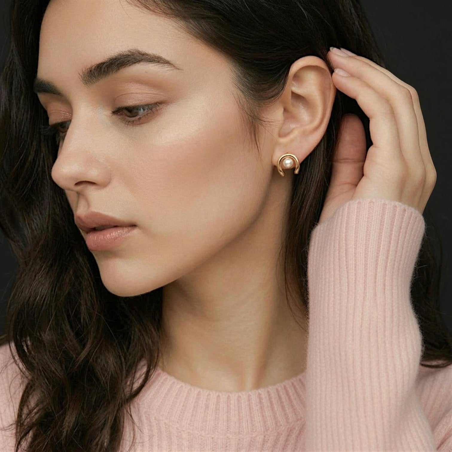 Amara Jewels gold plated sterling silver wave pearl stud earrings. Lustrous white pearls set in a modern wave design.