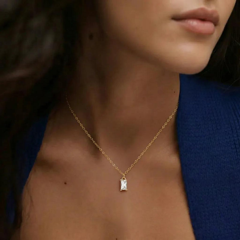 Amara Jewels gold-plated sterling silver necklace with a rectangular clear crystal pendant.