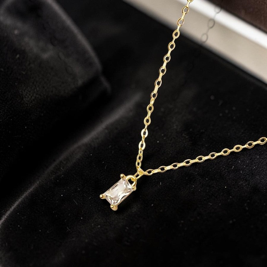 Amara Jewels gold-plated sterling silver necklace with a rectangular clear crystal pendant.