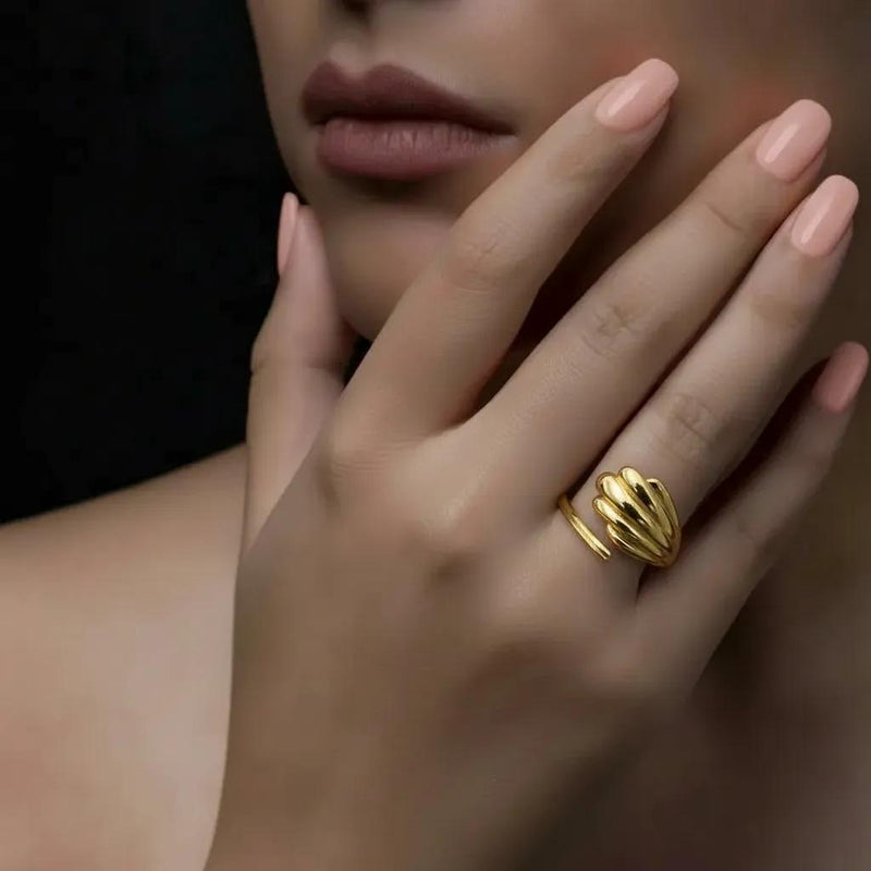 Amara Jewels gold shell open ring with wing design, polished finish, adjustable fit.