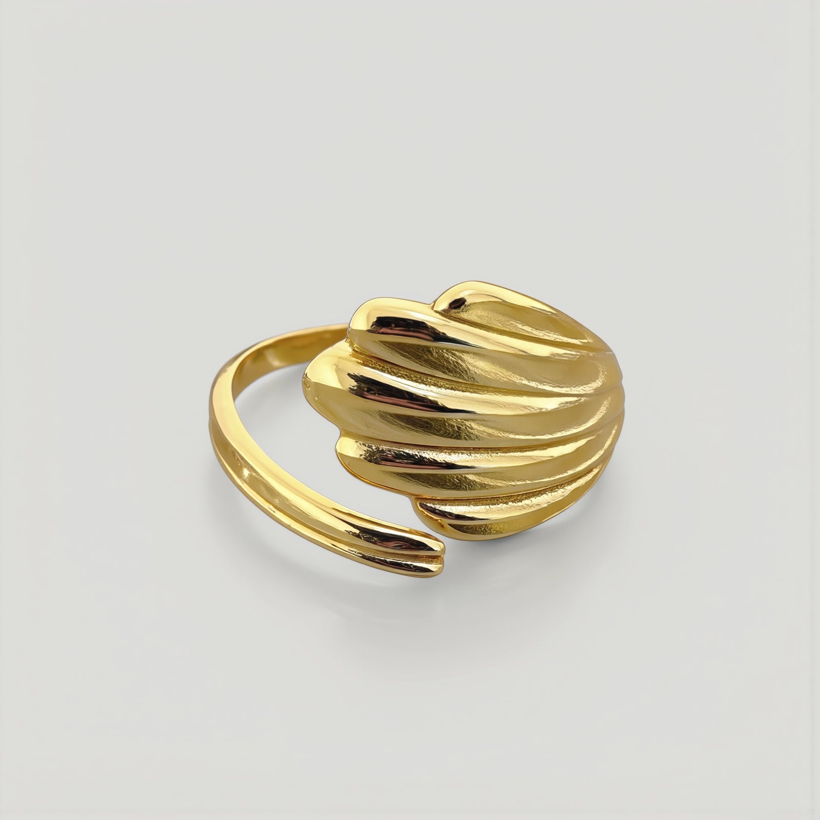 Amara Jewels gold shell open ring with wing design, polished finish, adjustable fit.