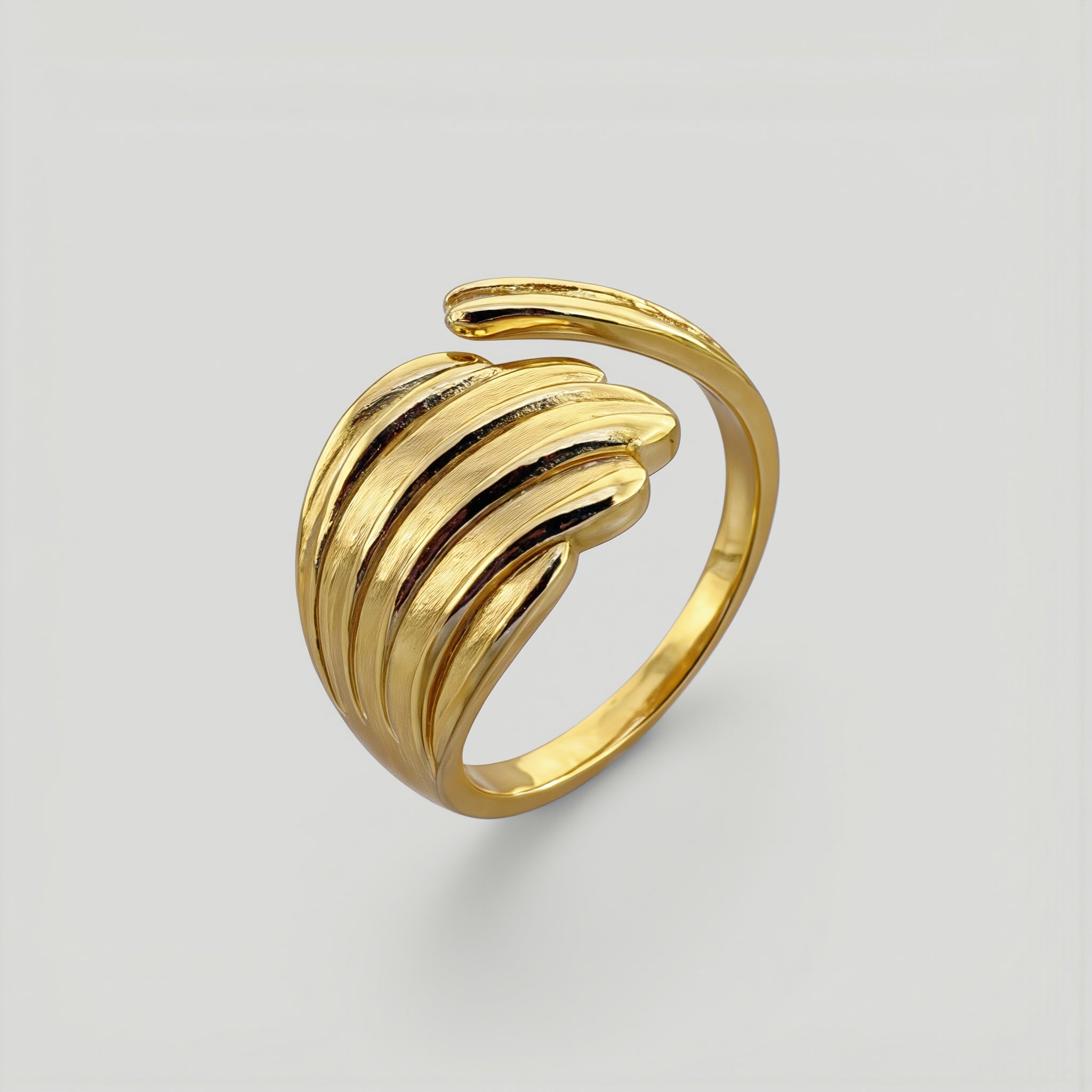 Amara Jewels gold shell open ring with wing design, polished finish, adjustable fit.