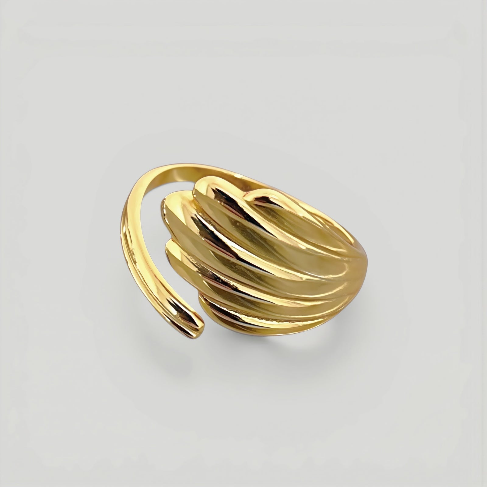 Amara Jewels gold shell open ring with wing design, polished finish, adjustable fit.