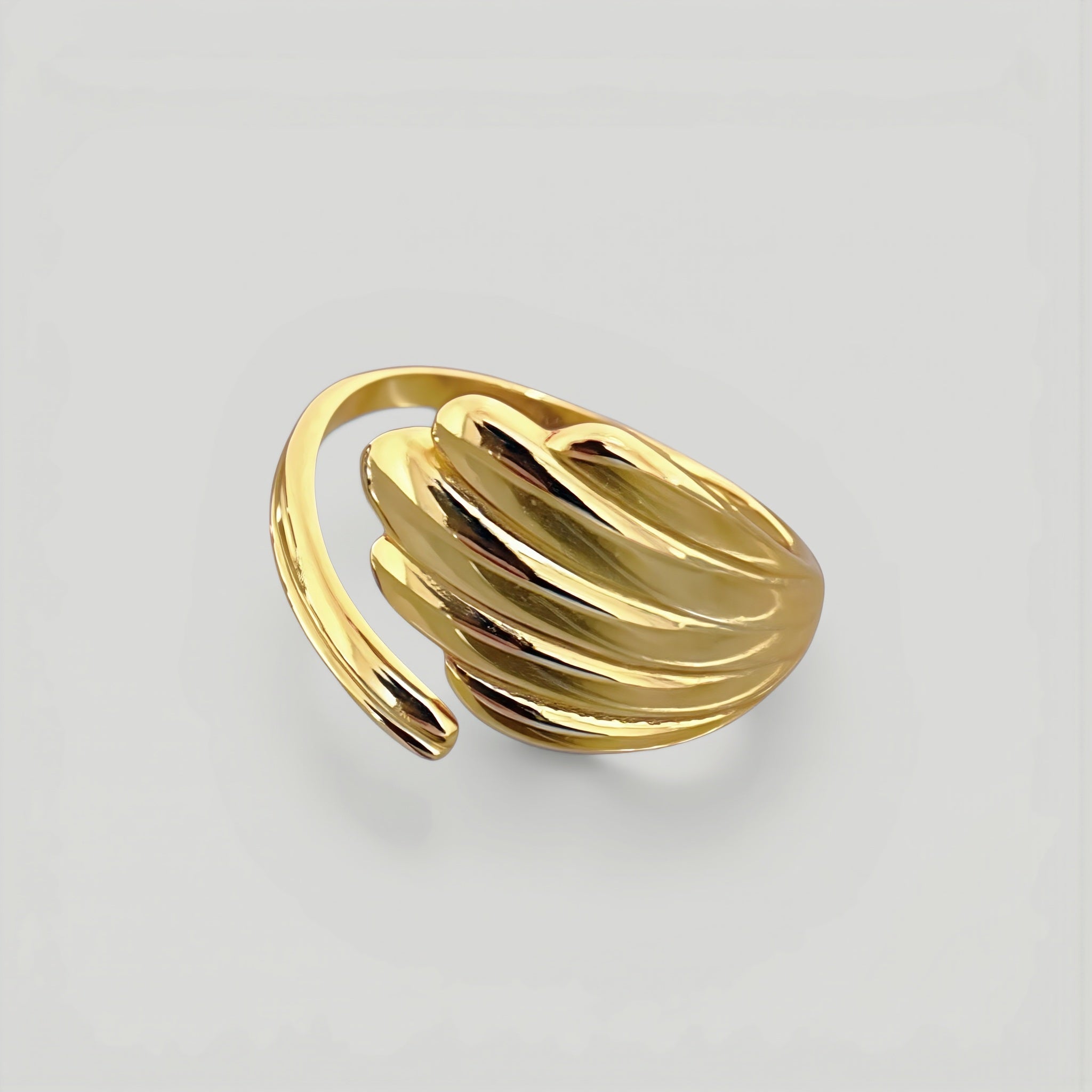 Amara Jewels gold shell open ring with wing design, polished finish, adjustable fit.