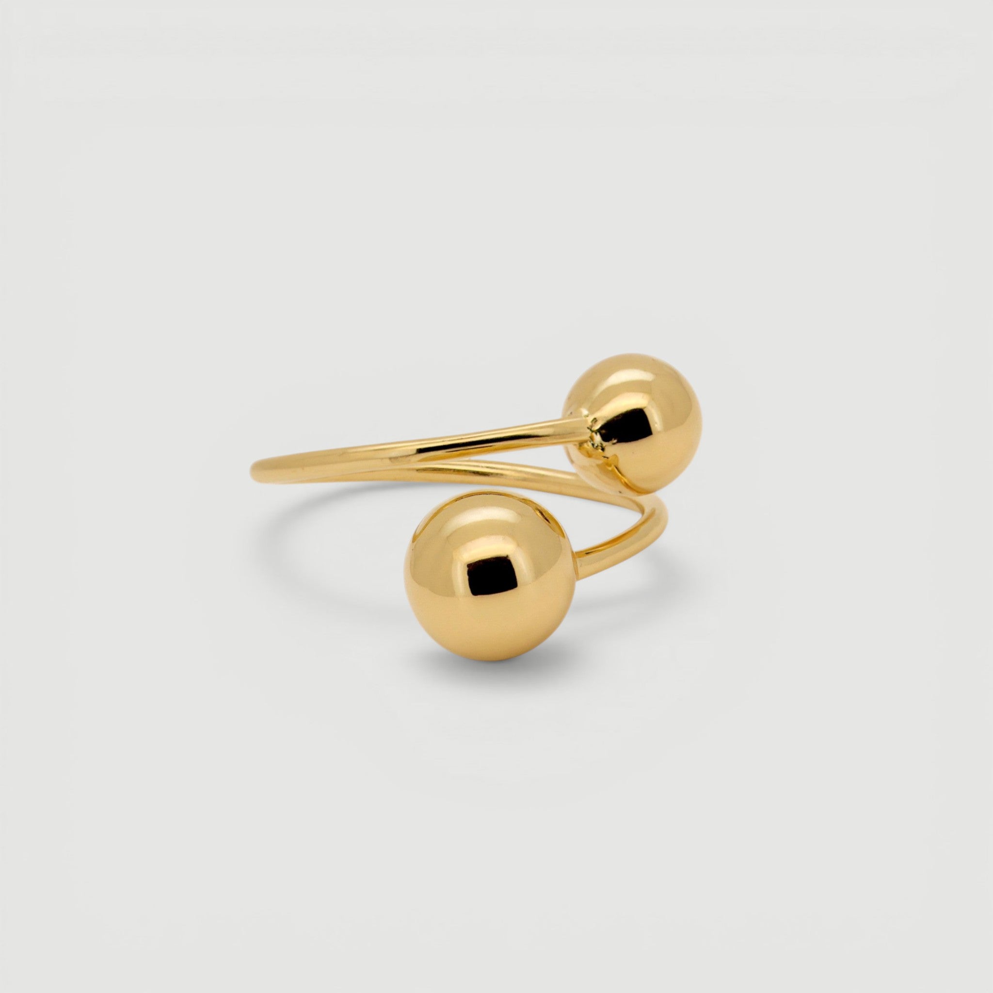 Amara Jewels bold Twin Sphere statement ring in 18K gold plated sterling silver with two polished spheres.