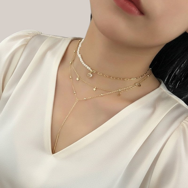 Amara Jewels gold finish sterling silver lariat necklace with star charms and bead accents, featuring a bar drop.