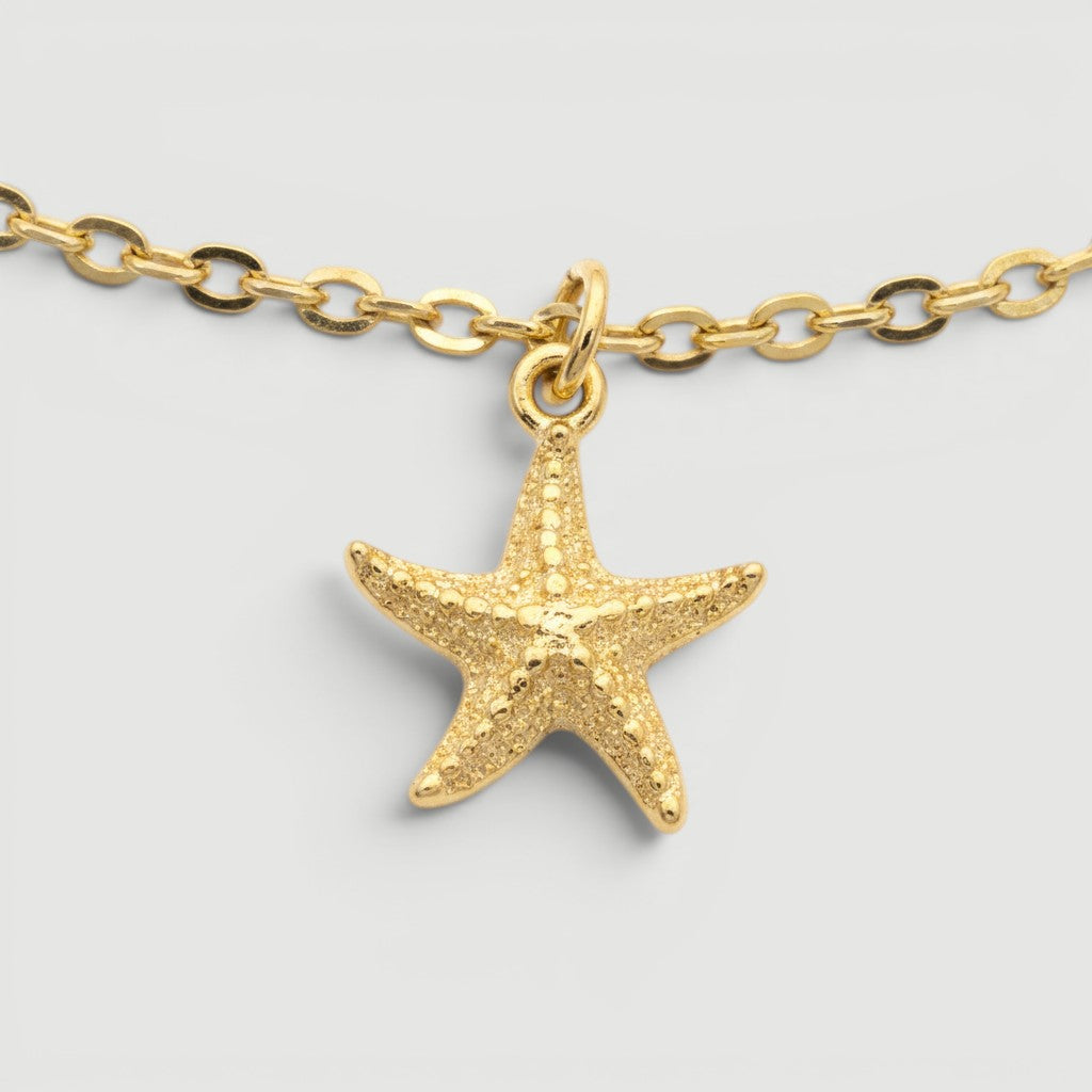 Amara Jewels gold-plated sterling silver bracelet with a detailed starfish charm, perfect for coastal elegance.