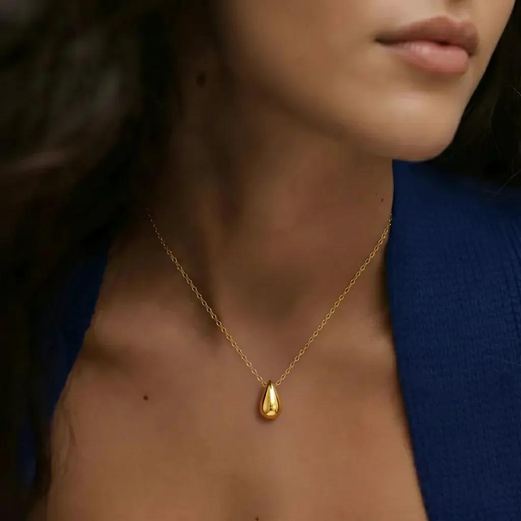Amara Jewels gold tone teardrop pendant necklace on a dainty chain, made of 925 sterling silver.