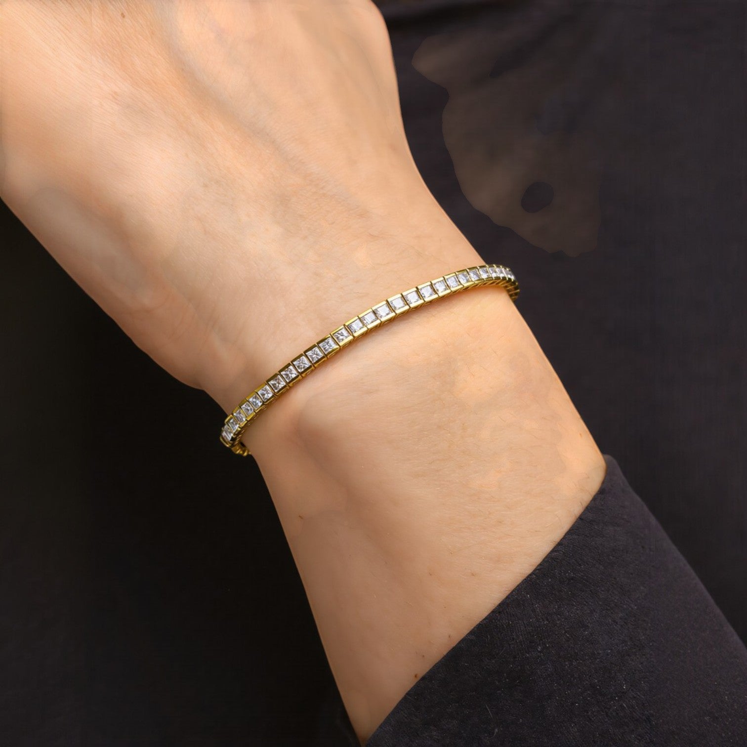Amara Jewels elegant gold tennis bracelet with sparkling square stones on sterling silver with gold finish.