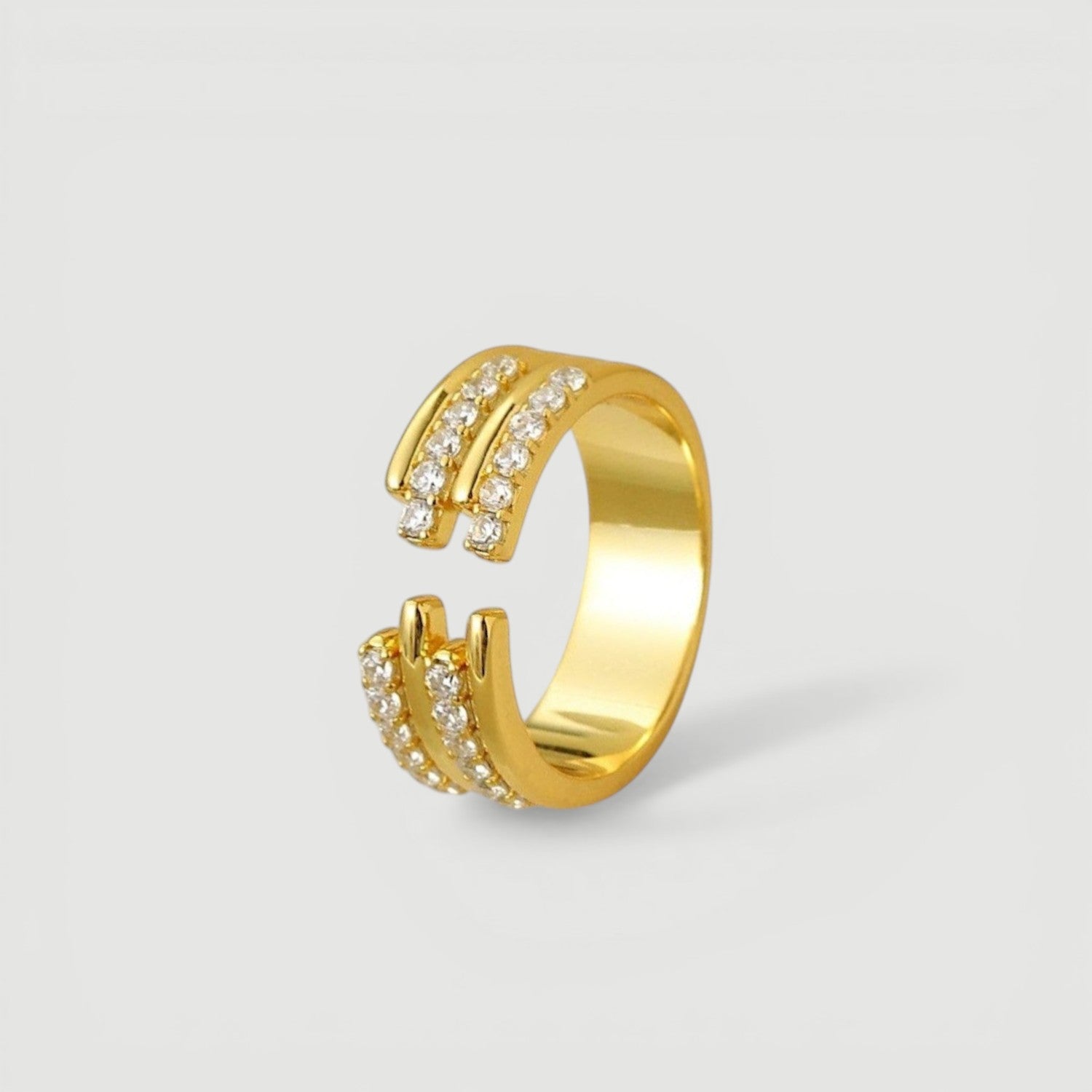 Amara Jewels gold-tone sterling silver open ring with three bands adorned with cubic zirconia.