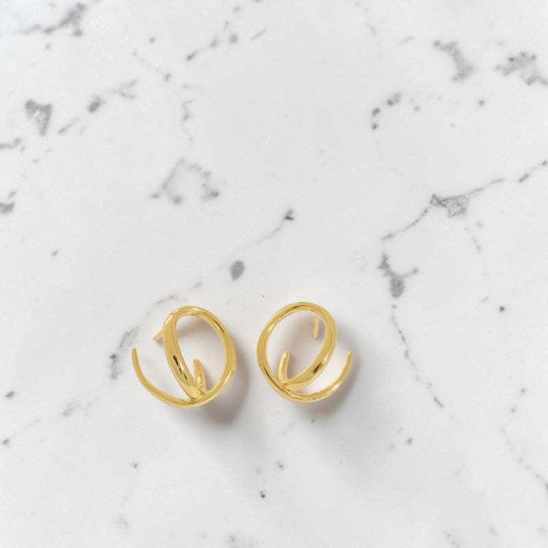 Amara Jewels gold-plated 925 sterling silver twisted hoop earrings with open-hoop design.